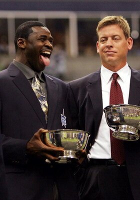 IRVING, TX - SEPTEMBER 19:  Michael Irvin and Troy Aikman, former players for the Dallas Cowboys celebrate after being inducted into the Dallas Cowboys Ring of Honor on September 19, 2005 at Texas Stadium in Irving, Texas.  (Photo by Ronald Martinez/Getty