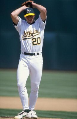 18 Apr 1999:  Pitcher Kevin Jarvis #20 of the Oakland Athletics winds up for the pitch during the game against the Texas Rangers at the Oakland Coliseum in Oakland, California. The Rangers defeated the Athletics 6-2. Mandatory Credit: Jed Jacobsohn  /Alls