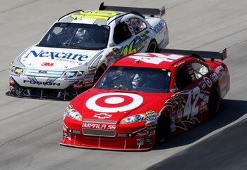 DOVER, DE - MAY 31: Juan Pablo Montoya, driver of the #42 Target Chevrolet, races Greg Biffle, driver of the #16 3M/Nexcare Ford, during the NASCAR Sprint Cup Series Autism Speaks 400 at Dover International Speedway on May 31, 2009 in Dover, Delaware.  (P