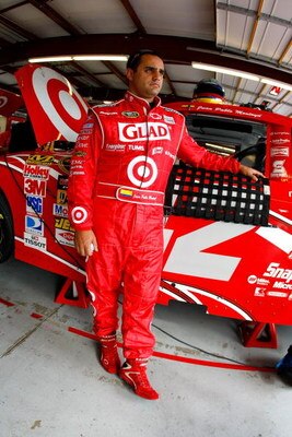 JOLIET, IL - JULY 09:  Juan Pablo Montoya leans on the #42 Target Chevrolet in the garage during practice for the NASCAR Sprint Cup Series LifeLock.com 400 at Chicagoland Speedway on July 9, 2009 in Joliet, Illinois.  (Photo by Jason Smith/Getty Images fo