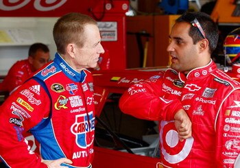 JOLIET, IL - JULY 10:  Mark Martin (L), driver of the #5 CARQUEST/Kellogg's Chevrolet, talks with Juan Pablo Montoya (R), driver of the #42 Target Chevrolet, prior to practice for the NASCAR Sprint Cup Series LifeLock.com 400 at Chicagoland Speedway on Ju