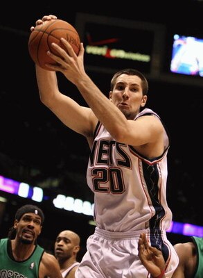 EAST RUTHERFORD, NJ - MARCH 04:  Ryan Anderson #20 of the New Jersey Nets grabs a rebound against the Boston Celtics during their game on March 4th, 2009 at The Izod Center in East Rutherford, New Jersey.  NOTE TO USER: User expressly acknowledges and agr