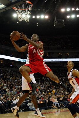 OAKLAND, CA - DECEMBER 12:  Carl Landry #14 of the Houston Rockets lays the ball up past Anthony Randolph #4 of the Golden State Warriors during the game on December 12, 2008 at Oracle Arena in Oakland, California.  The Rockets won 119-108.  NOTE TO USER: