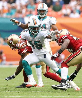 MIAMI - DECEMBER 14:  Wide receiver Davone Bess #15 of the Miami Dolphins breaks through for extra yardage on a kick return while taking on the San Francisco 49ers at Dolphin Stadium on December 14, 2008 in Miami, Florida. The Dolphins defeated the 49ers 