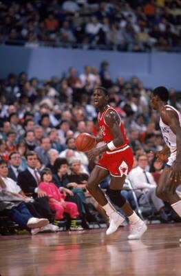 LOS ANGELES, CA:  Michael Jordan #23 of the Chicago Bulls brings the ball upcourt against the Los Angeles Clippers during a 1984-85 season game at the Sports Arena in Los Angeles, California.  (Photo by Rick Stewart/Getty Images)