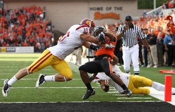 PASADENA, CA - JANUARY 01:  Taylor Mays #2 of the USC Trojans tackles quarterback #7 Juice Williams of the Illinois Fighting Illini in the second half during the Rose Bowl presented by Citi at the Rose Bowl on January 1, 2008 in Pasadena, California.  (Ph