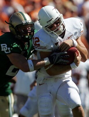 WACO, TX - OCTOBER 20:  Quarterback Colt McCoy #12 of the Texas Longhorns rusn the ball against Jordan Lake #21 of the Baylor Bears at Floyd Casey Stadium on October 20, 2007 in Waco, Texas.  (Photo by Ronald Martinez/Getty Images)