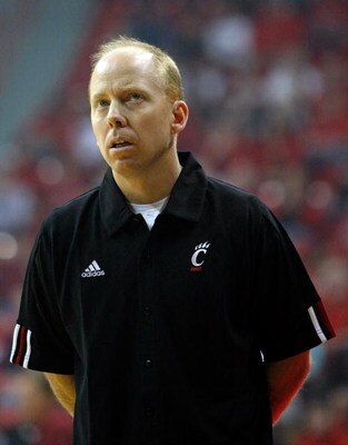 LAS VEGAS - NOVEMBER 29:  Cincinnati head coach Mick Cronin checks the scoreboard as his team takes on UNLV during the Global Sports Classic tournament at the Thomas & Mack Center November 29, 2008 in Las Vegas, Nevada. Cincinnati won 67-65.  (Photo by Et