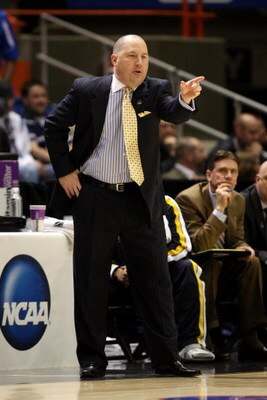 BOISE, ID - MARCH 20:  Head Coach Buzz Williams of the Marquette Golden Eagles adjusts his team during the game against the Utah State Aggies during the first round of the NCAA Division I Men's Basketball Tournament at the Taco Bell Arena on March 20, 200