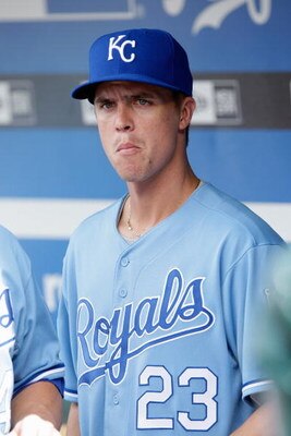 KANSAS CITY, MO - JUNE 20:  Zack Greinke #23 of the Kansas City Royals watches from the dugout during the game against the St. Louis Cardinals on June 20, 2009 at Kauffman Stadium in Kansas City, Missouri. (Photo by Jamie Squire/Getty Images)