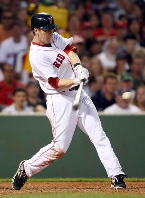 BOSTON - JULY 06:  Jason Bay #44 of the Boston Red Sox gets a hit against the Oakland Athletics on July 6, 2009 at Fenway Park in Boston, Massachusetts. The Athletics defeated the Red Sox 6-0. (Photo by Elsa/Getty Images)