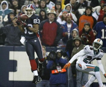 ORCHARD PARK, NY - DECEMBER 17:  Lee Evans #83 of the Buffalo Bills makes his second touchdown catch of the game ahead of Andre Goodman #29 of the Miami Dolphins on December 17, 2006 at Ralph Wilson Stadium in Orchard Park, New York. Buffalo won 21-0.  (P