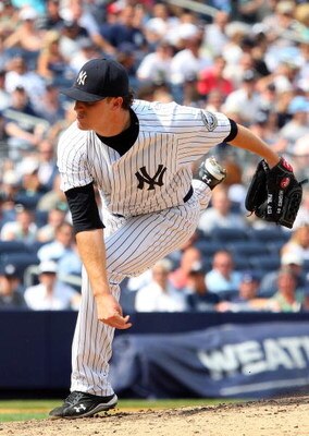 NEW YORK - JULY 22:  Phil Hughes #65 of the New York Yankees pitches against the Baltimore Orioles on July 22, 2009 at Yankee Stadium in the Bronx borough of New York City.  (Photo by Jim McIsaac/Getty Images)
