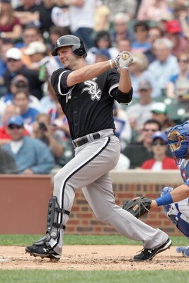 CHICAGO - JUNE 17: Paul Konerko #14 of the Chicago White Sox swings at the pitch against the Chicago Cubs on June 17, 2009 at Wrigley Field in Chicago, Illinois. (Photo by Jonathan Daniel/Getty Images)
