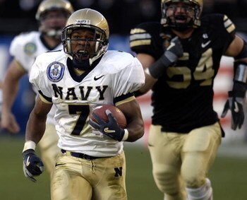 PHILADELPHIA - DECEMBER 3:  In this handout provided by the U.S. Coast Guard, running back Reggie Campbell #7 of the Navy Midshipmen runs for a touchdown during the 106th Army v Navy football game on December 3, 2005 held for the third consecutive year at