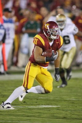 LOS ANGELES - NOVEMBER 29:  Stanley Havili #31 of the USC Trojans carries the ball against the Notre Dame Fighting Irish on November 29, 2008 at the Los Angeles Memorial Coliseum in Los Angeles, California.  USC won 38-3.  (Photo by Jeff Golden/Getty Imag