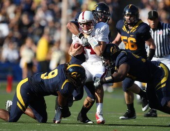 BERKELEY, CA - NOVEMBER 22: Tavita Pritchard #14 of the Stanford Cardinal is sacked by Eddie Young #9 of the California Golden Bears during an NCAA football game on November 22, 2008 at Memorial Stadium in Berkeley, California.  (Photo by Jed Jacobsohn/Ge