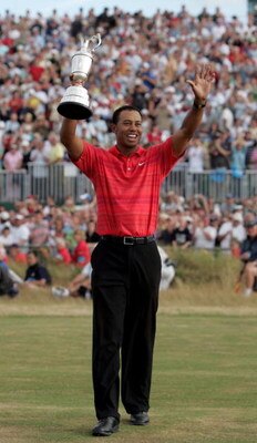 HOYLAKE, UNITED KINGDOM - JULY 23:  Tiger Woods of USA celebrates with the claret jug following his two shot victory at the end of the final round of The Open Championship at Royal Liverpool Golf Club on July 23, 2006 in Hoylake, England.  (Photo by Andy 