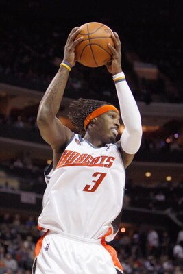 CHARLOTTE, NC - MARCH 13:  Gerald Wallace #3 of the Charlotte Bobcats rebounds the ball against the Houston Rockets during their game at Time Warner Cable Arena on March 13, 2009 in Charlotte, North Carolina. NOTE TO USER: User expressly acknowledges and 