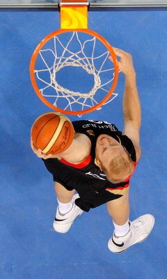 BEIJING - AUGUST 18:   Chris Kaman #12 of Germany dunks over the defense of the United States during the men?s basketball preliminaries at the Wukesong Indoor Stadium on Day 10 of the Beijing 2008 Olympic Games on August 18, 2008 in Beijing, China.  (Phot
