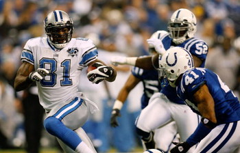 INDIANAPOLIS - DECEMBER 14: Calvin Johnson #81 of the Detroit Lions gets past Antoine Bethea #41 of the Indianapolis Colts to score a touchdown on December 14, 2008 at Lucas Oil Stadium in Indianapolis, Indiana. (Photo by Chris Graythen/Getty Images)