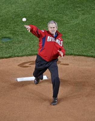 WASHINGTON - MARCH 30: US President George W. Bush throws out the first pitch during the Washington Nationals opening home game against the Atlanta Braves at Nationals Park March 30, 2008 in Washington, DC. President Bush attended the home opener which