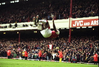 18 Apr 1998:  Christopher Wreh of Arsenal celebrates scoring a goal by showing off his gymnastic skills during the match between Arsenal v Wimbledon in the FA Carling Premiership played at Highbury, London, England. Arsenal 5-0. \ Mandatory Credit: Allspo