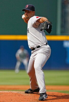 ATLANTA - JUNE 27:  Starting pitcher Tim Wakefield #49 of the Boston Red Sox pitches against the Atlanta Braves at Turner Field on June 27, 2009 in Atlanta, Georgia.  (Photo by Kevin C. Cox/Getty Images)