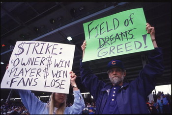 CHICAGO - AUGUST 10:  Fans hold up signs in protest of the baseball strike during a game between the San Francisco Giants and the Chicago Cubs at Wrigley Field in Chicago, Illinios.  The Giants won the game 5-2.(Photo by Jonathan Daniel/Getty Images)