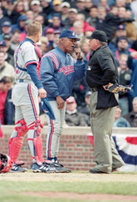 2 Apr 2001:  Head Coach Felipe Alou and Michael Barrett #5 of the Montreal Expos discuss a questionable call with Umpire Rick Reed during the Opening Day game against the Chicago Cubs at Wrigley Field in Chicago, Illinois.  The Expos defeated the Cubs 5-4