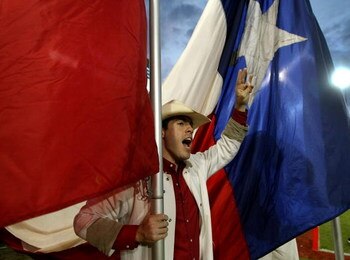 HOUSTON - NOVEMBER 17: A Houston Cougars cheerleader yells during the game against the Marshall Thundering Herd at Robertson Stadium November 17, 2007 in Houston, Texas. Houston won 35-28.  (Photo by Stephen Dunn/Getty Images)