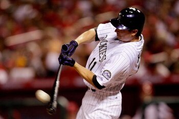 ST LOUIS, MO - JULY 14:  National League All-Star Brad Hawpe of the Colorado Rockies hits a deep fly that was caught by Carl Crawford of the Tampa Bay Reys against the fence during the 2009 MLB All-Star Game at Busch Stadium on July 14, 2009 in St Louis, 