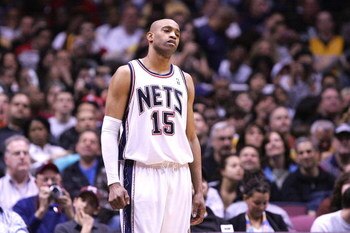 EAST RUTHERFORD, NJ - MARCH 27:  Vince Carter #15 of the New Jersey Nets watches on against the Los Angeles Lakers during their game on March 27, 2009 at the Izod Center in East Rutherford, New Jersey. NOTE TO USER: User expressly acknowledges and agrees 
