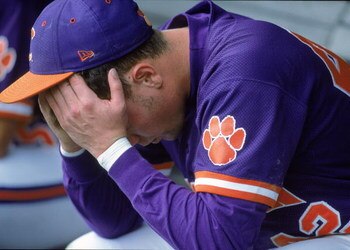14 Jun 2000: Ryan Riley #42 of the Clemson Tigers hangs his head as he sits in the dugout during the College World Series againt the Louisiana Lafayette Ragin Cajuns at the Resenblatt Stadium in Omaha, Nebraska. The Raggin Cajuns defeated the Tigers 6-3.M