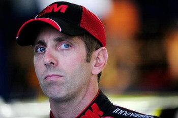 CONCORD, NC - OCTOBER 15:  Greg Biffle, driver of the #16 3M Ford, stands in the garage during practice for the NASCAR Sprint Cup Series NASCAR Banking 500 at Lowe's Motor Speedway on October 15, 2009 in Concord, North Carolina.  (Photo by Sam Greenwood/G