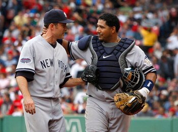 BOSTON - SEPTEMBER 28: Mike Mussina #35 and Jose Molina #26 of the New York Yankees react against the Boston Red Sox at Fenway Park September 28, 2008 in Boston, Massachusetts. (Photo by Jim Rogash/Getty Images)