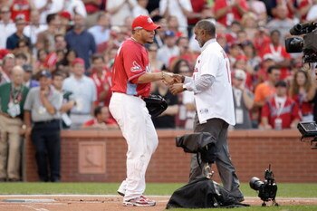ST LOUIS, MO - JULY 13: Hall of Famer Ozzie Smith shakes hands with catcher Yadier Molina of the St. Louis Cardinals before the State Farm Home Run Derby at Busch Stadium on July 13, 2009 in St. Louis, Missouri. (Photo by Jamie Squire/Getty Images)