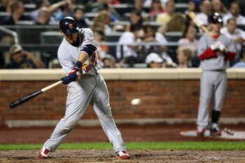 NEW YORK - JUNE 23: Yadier Molina #4 of the St. Louis Cardinals bats against the New York Mets at Citi Field on June 23, 2009 in the Flushing neighborhood of the Queens borough of New York City.  (Photo by Michael Heiman/Getty Images)