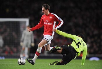 LONDON - NOVEMBER 11:  Mark Randall (L) of Arsenal is tackled by Wilson Palacios of Wigan during the Carling Cup fourth round match between Arsenal and Wigan Athletic at the Emirates Stadium on November 11, 2008 in London, England.  (Photo by Shaun Botter