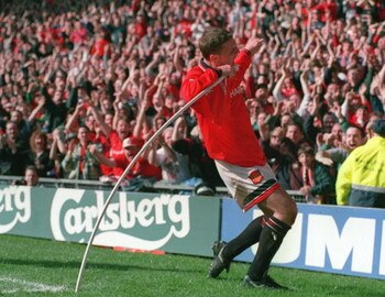 12 MAR 1995:  LEE SHARPE OF MANCHESTER UNITED CELEBRATES BY MAKING A SONG AND DANCE AFTER SCORING UNITEDS FIRST GOAL AGAINST QUEENS PARK RANGERS IN THE SIXTH ROUND OF THE FA CUP AT OLD TRAFFORD, MANCHESTER. Mandatory Credit: Shaun Botterill/ALLSPORT