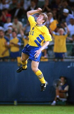 24 JUN 1994:  THOMAS BROLIN OF SWEDEN LEAPS FOR JOY AFTER SCORING AGAINST RUSSIA DURING THE  1994 WORLD CUP AT THE SILVERDOME IN PONTIAC, MICHIGAN.  THE FIRST-HALF GOAL TIED THE GAME AT 1-1. Mandatory Credit: JONATHAN DANIEL/ALLSPORT