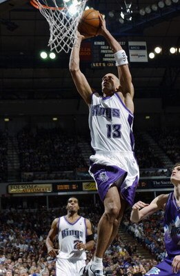 SACRAMENTO, CA - APRIL 16:  Doug Christie #13 of the Sacramento Kings dunks against the Utah Jazz during the game at Arco Arena on April 16, 2003 in Sacramento, California.  The Kings won 95-84.  NOTE TO USER: User expressly acknowledges and agrees that, 