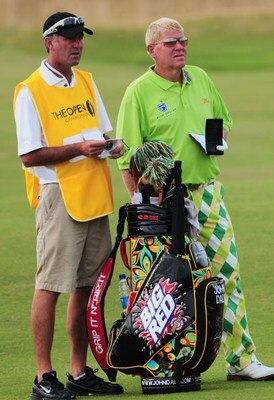 TURNBERRY, SCOTLAND - JULY 16:  John Daly of USA lines up a shot with his caddy during round one of the 138th Open Championship on the Ailsa Course, Turnberry Golf Club on July 16, 2009 in Turnberry, Scotland.  (Photo by Stuart Franklin/Getty Images)