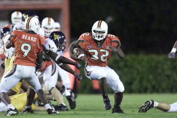 25 Oct 2001:  Frank Gore of Miami races past the defense of West Virginia during the game at the Orange Bowl in Miami, Florida. The University Of Miami won 45-3. DIGITAL IMAGE. Mandatory Credit: Eliot Schechter/Allsport