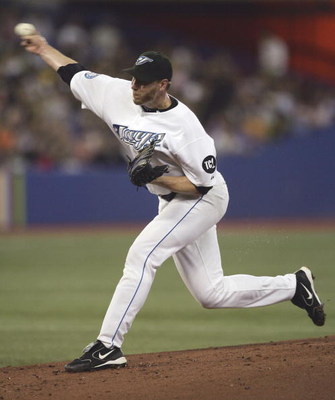 TORONTO - JULY 20:  Roy Halladay #32 of the Toronto Blue Jays pitches in the 2nd inning against the New York Yankees on July 20, 2006 at the Rogers Centre in Toronto, Ontario, Canada.  (Photo by Harry How/Getty Images)