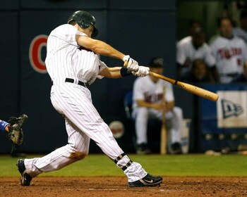 MINNEAPOLIS, MN- SEPTEMBER 28: Joe Mauer #7 of the Minnesota Twins triples in the eighth inning against the Kansas City Royals at the Metrodome on September 28, 2008 in Minneapolis, Minnesota. The Twins defeated the Royals 6-0. (Photo by Scott A. Schneide