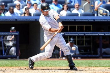 NEW YORK - JULY 06:  Jorge Posada #20 of the New York Yankees bats against the Toronto Blue Jays on July 6, 2009 at Yankee Stadium in the Bronx borough of New York City. The Jays defeated the yankees 7-6.  (Photo by Jim McIsaac/Getty Images)