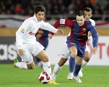 YOKOHAMA, JAPAN - DECEMBER 17: Alexandre Pato of Sport Club Internacional and Iniesta of FC Barcelona battle for the ball during the final of the FIFA Club World Cup Japan 2006 between Sport Club Internacional and FC Barcelona at the International Stadium