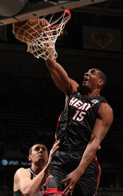 MILWAUKEE - JANUARY 09: Mark Blount #15 of the Miami Heat dunks the ball over Andrew Bogut #6 of the Milwaukee Bucks on January 9, 2008 at the Bradley Center in Milwaukee, Wisconsin. NOTE TO USER: User expressly acknowledges and agreees that, by downloadi
