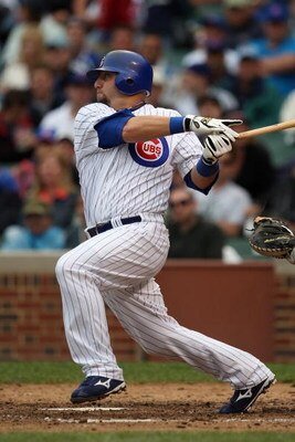 CHICAGO - JULY 8:  Jake Fox #5 of the Chicago Cubs bats against the Atlanta Braves during the game on July 8, 2009 at Wrigley Field in Chicago, Illinois. (Photo by Jonathan Daniel/Getty Images) 